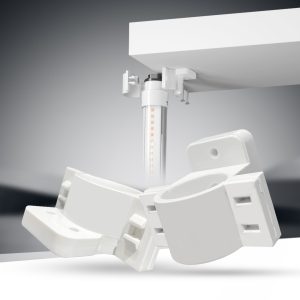 A white light fixture with a bulb on top, mounted on a bracket.